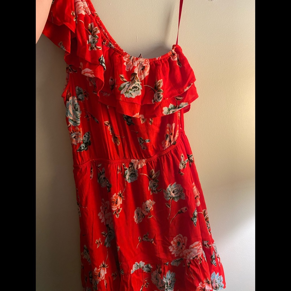 New with tags, off one shoulder red floral dress.